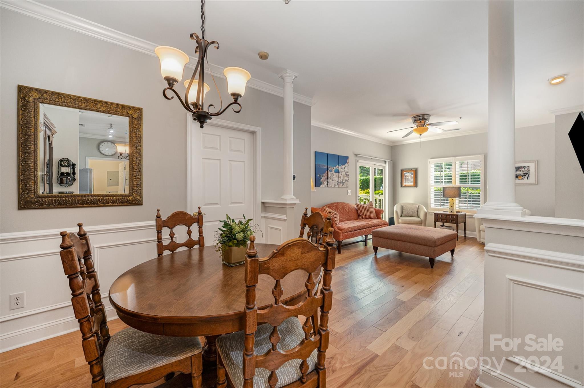 5730 Closeburn Road, Unit G Charlotte, NC 28210 - Photo 11 of 30 a view of a dining room with furniture window and wooden floor