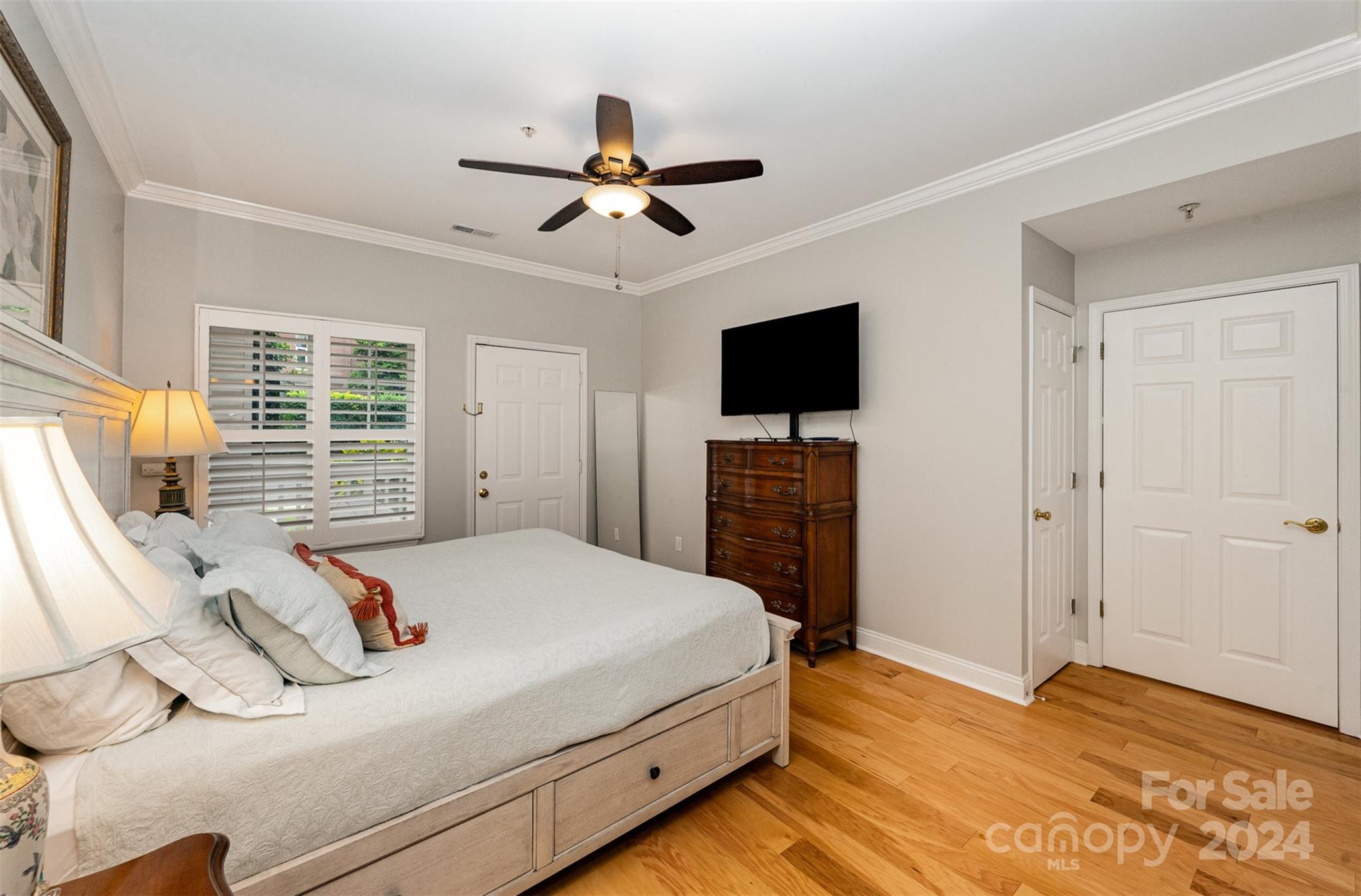 5730 Closeburn Road, Unit G Charlotte, NC 28210 - Photo 17 of 30 a bedroom with a bed and a flat screen tv