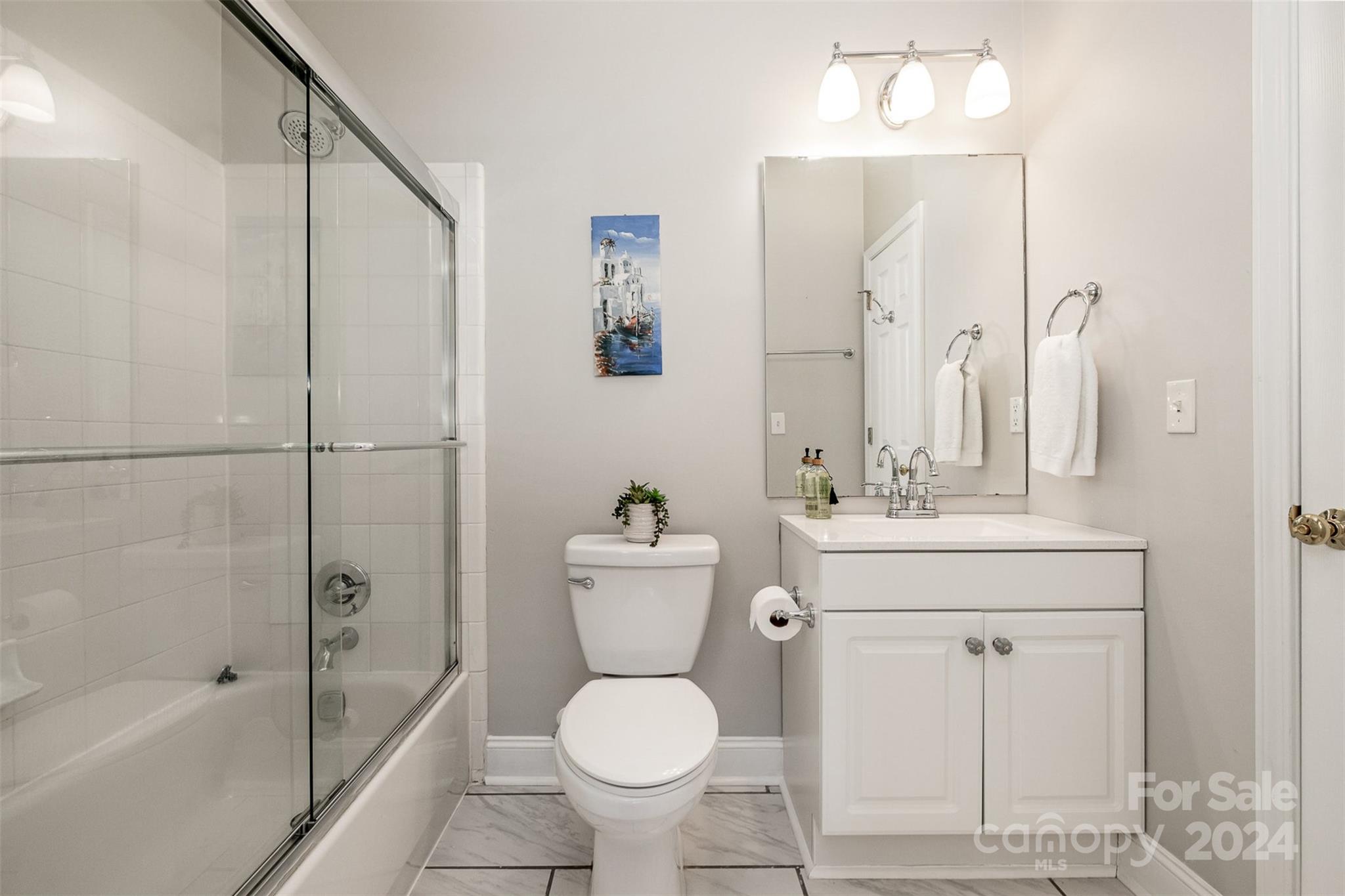 5730 Closeburn Road, Unit G Charlotte, NC 28210 - Photo 23 of 30 a bathroom with a sink toilet and shower