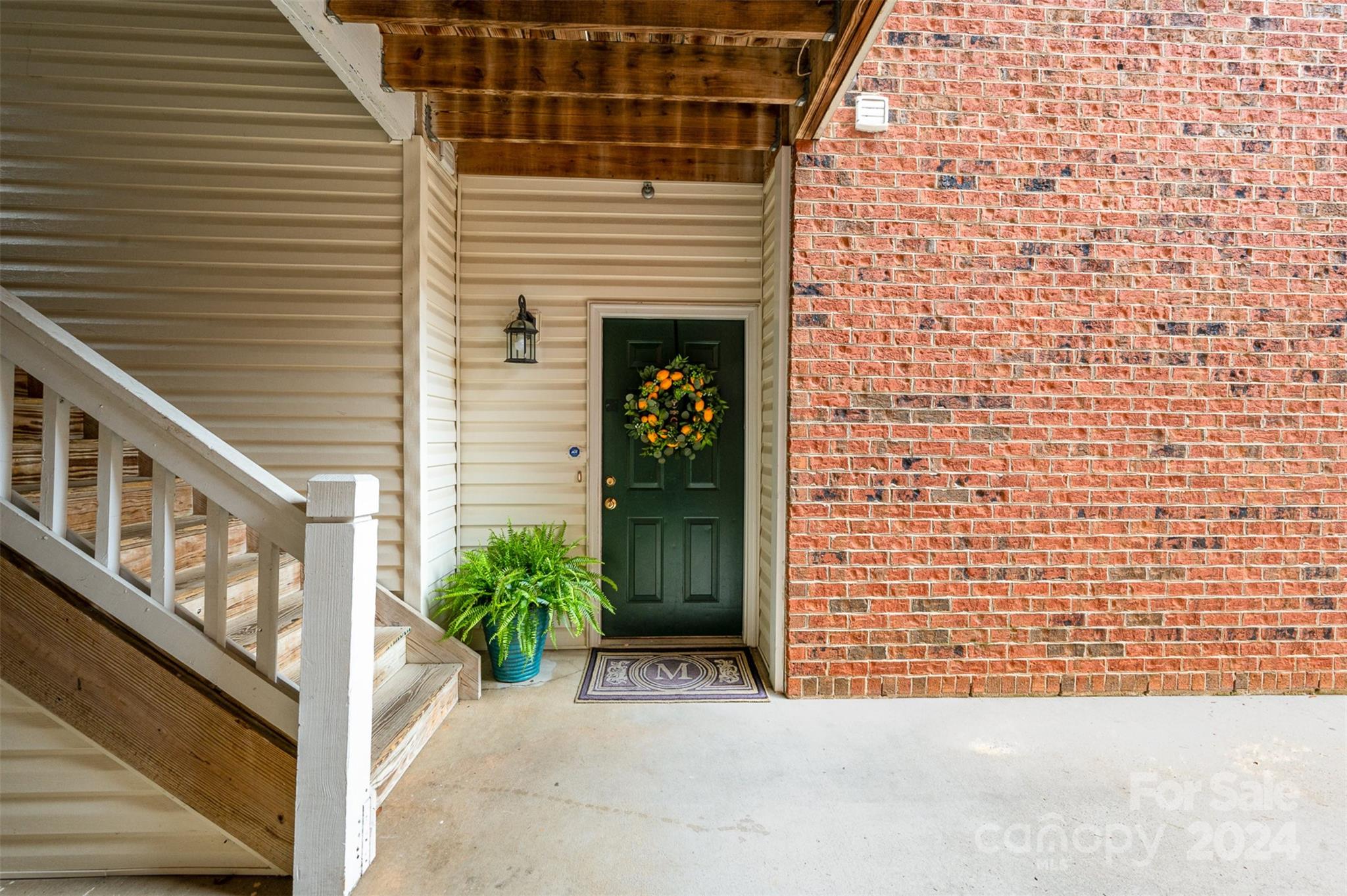 5730 Closeburn Road, Unit G Charlotte, NC 28210 - Photo 4 of 30 a view of a brick house with an outdoor space