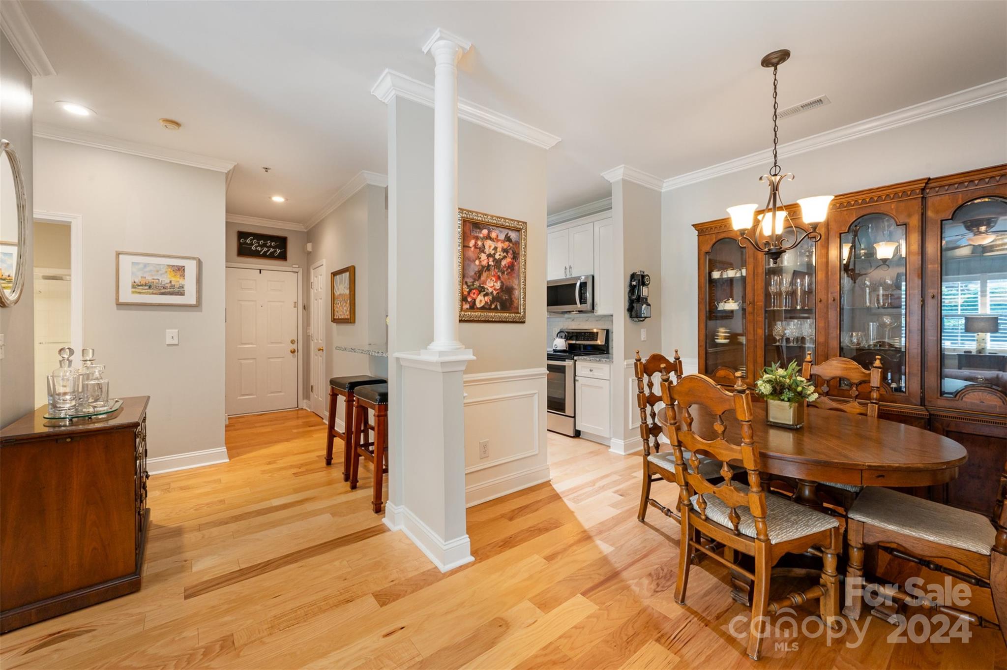 5730 Closeburn Road, Unit G Charlotte, NC 28210 - Photo 6 of 30 a view of a dining room with furniture window and wooden floor