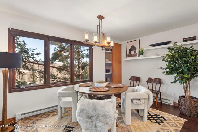 a view of a dining room with furniture window and outside view