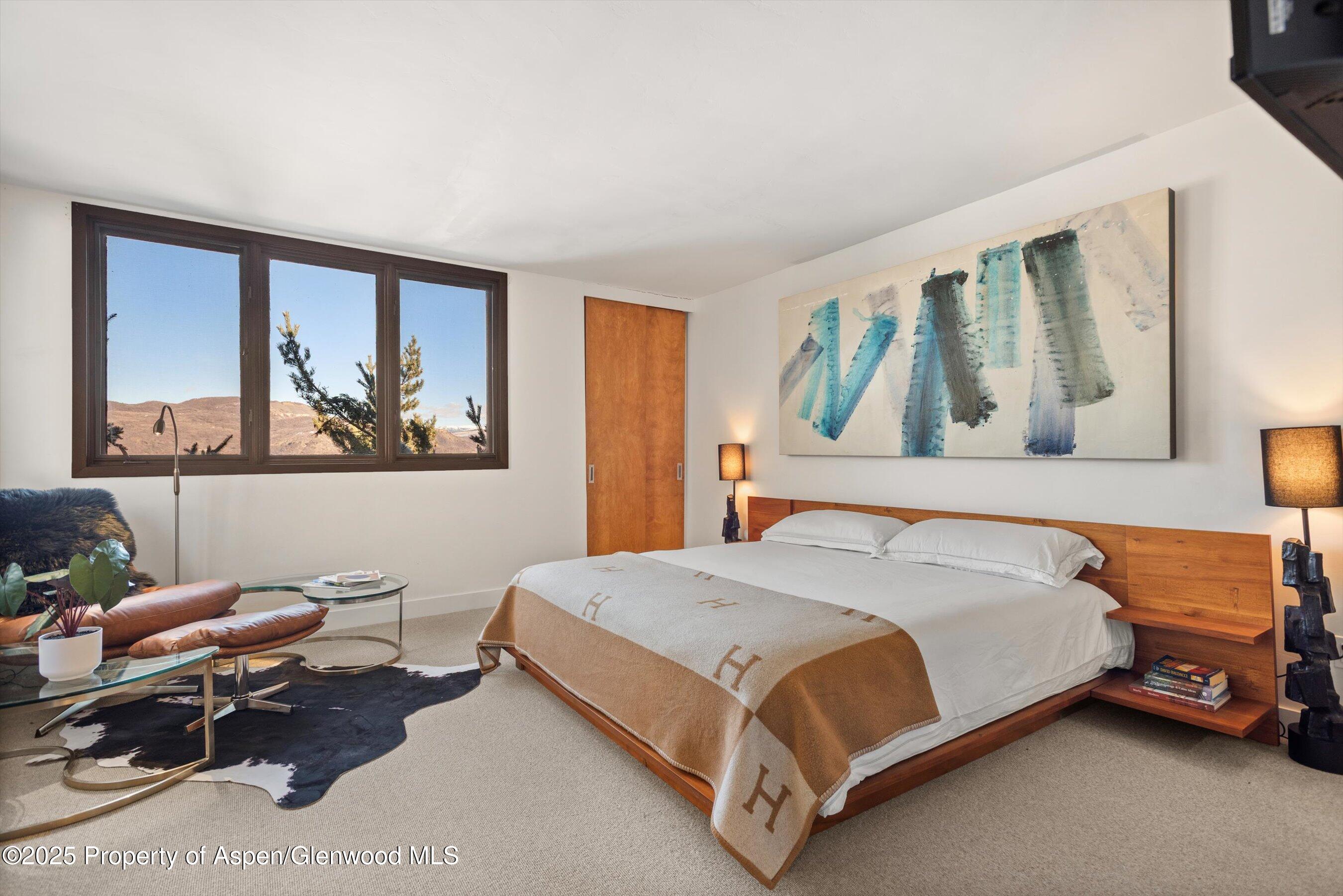 382 Meadow Ranch Road, Unit F4B Snowmass Village, CO 81615 - Photo 17 of 30 a bedroom with a bed and a window