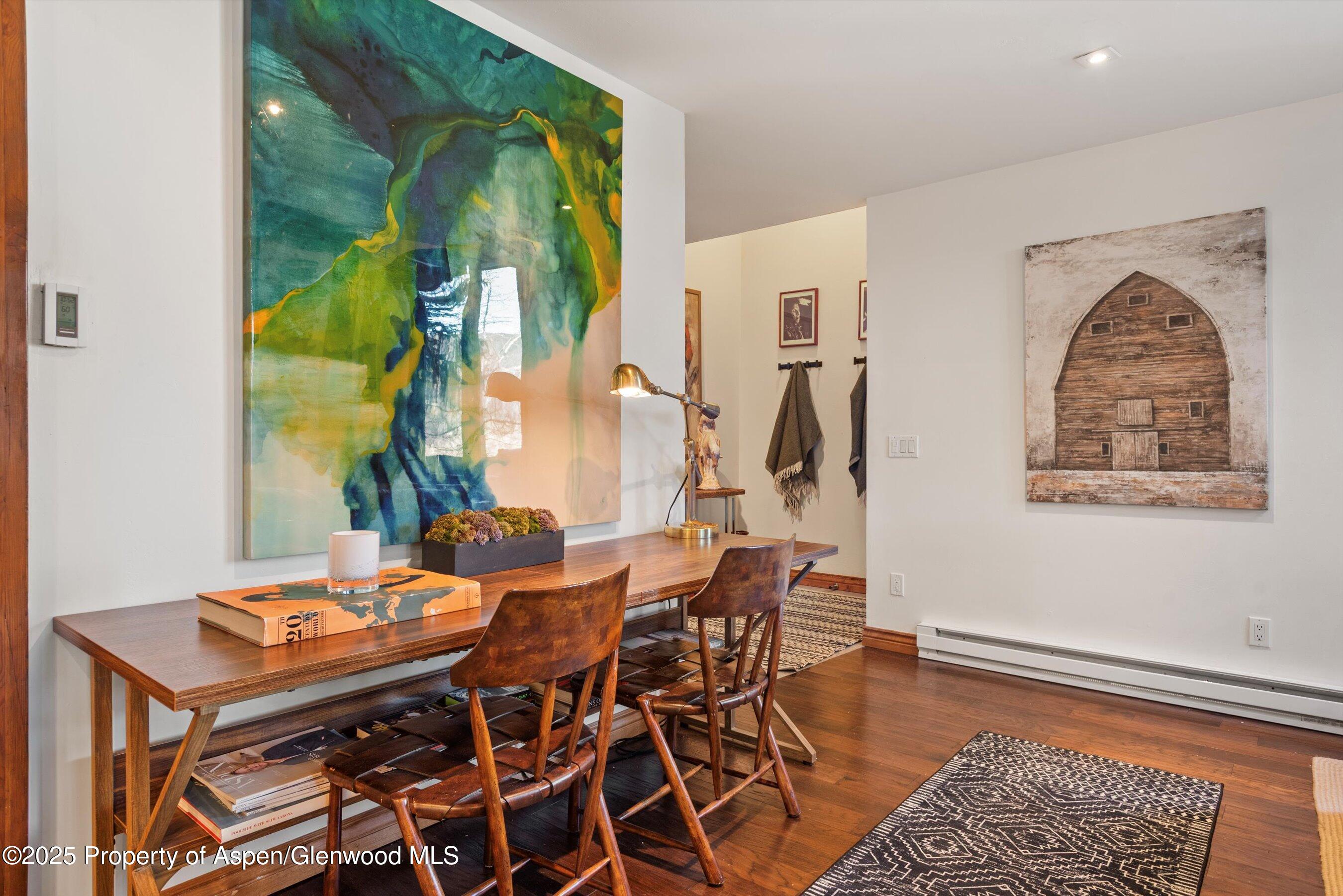 382 Meadow Ranch Road, Unit F4B Snowmass Village, CO 81615 - Photo 24 of 30 a view of a dining room with furniture window and wooden floor