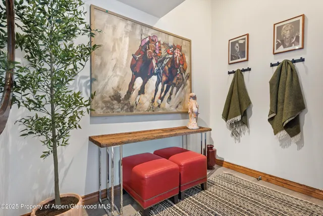 a view of a livingroom with furniture and staircase