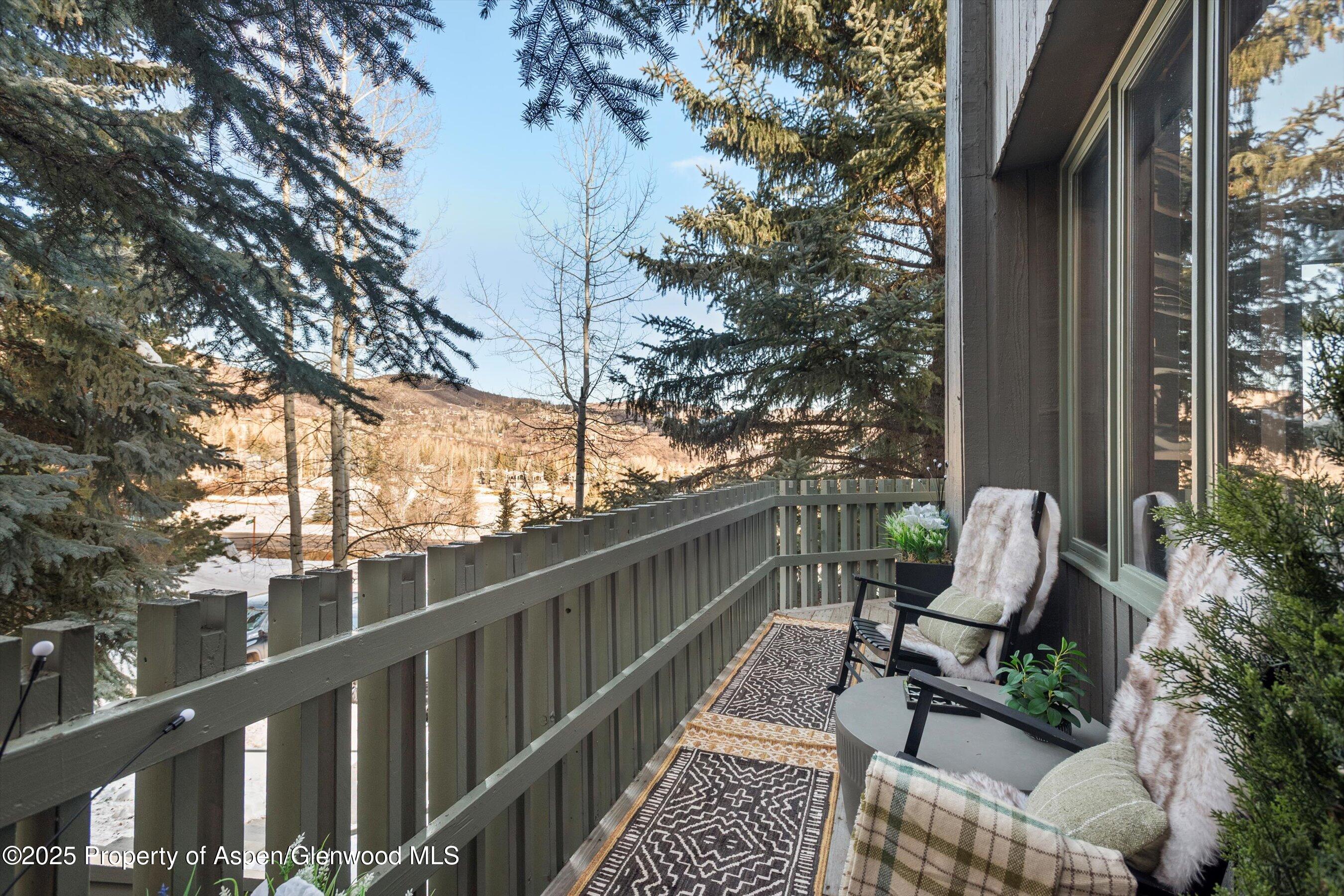 382 Meadow Ranch Road, Unit F4B Snowmass Village, CO 81615 - Photo 28 of 30 a view of balcony with furniture and outdoor seating