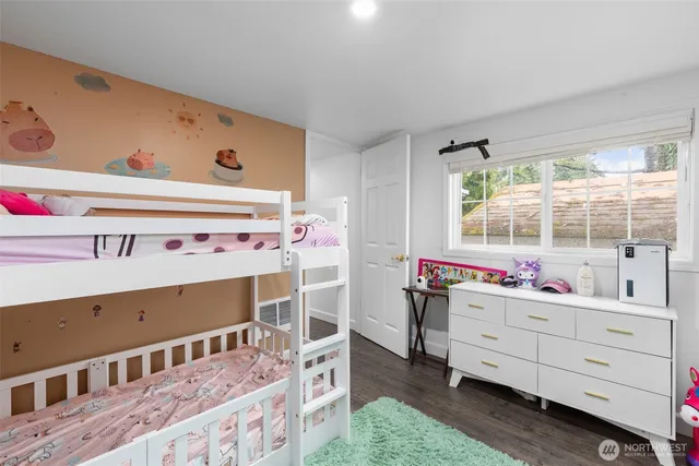 a bed room with a bed and a window