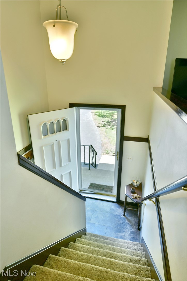 379 Housel Craft Road Bristolville, OH 44402 - Photo 10 of 50 Stairway featuring tile patterned flooring