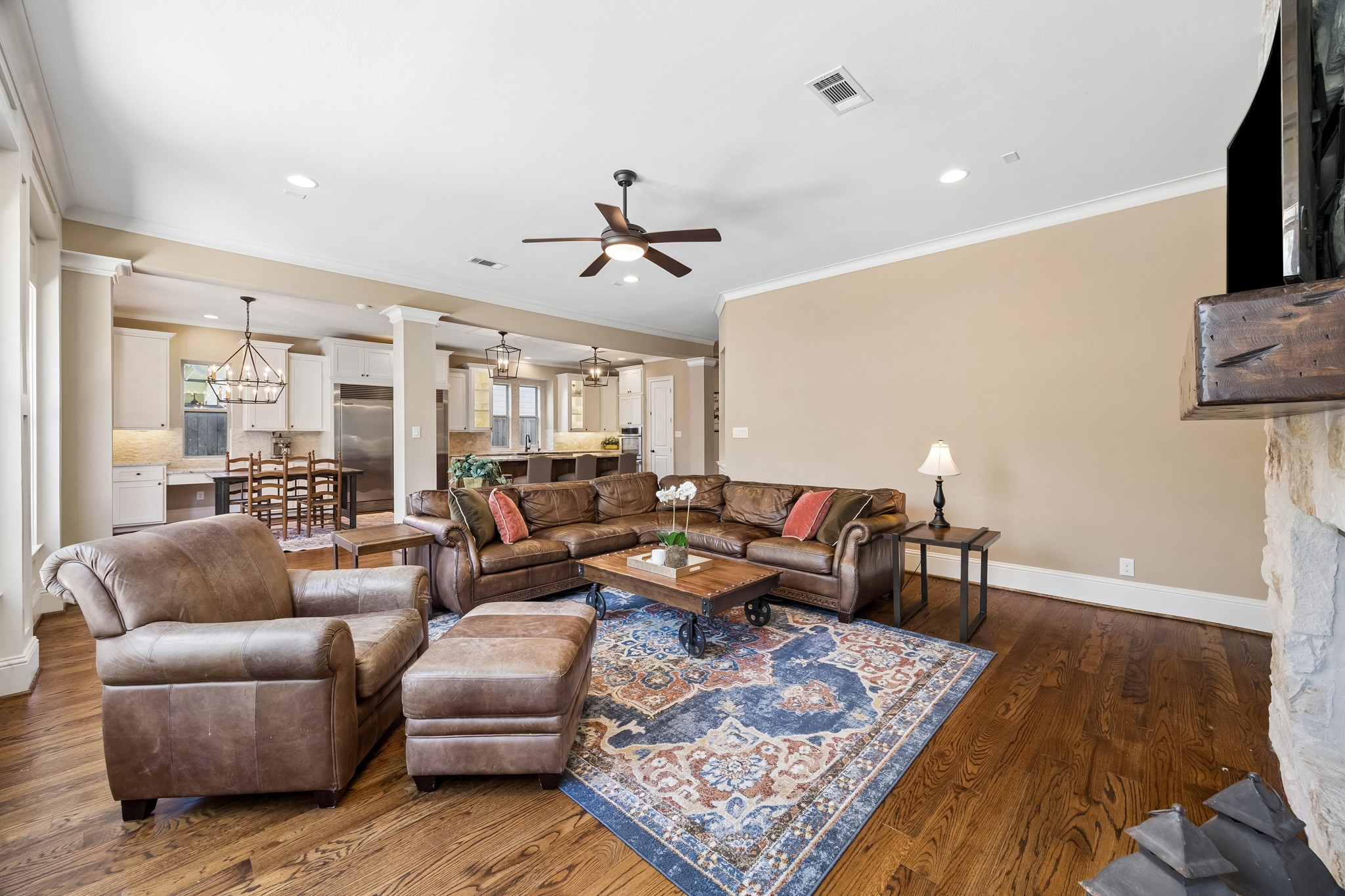 1360 Chippendale Road Houston, TX 77018 - Photo 14 of 34 Another view of the family room highlighting the seamless flow between the kitchen, breakfast area, and living spaces. Open-concept design creates the perfect setting for entertaining guests or enjoying everyday family life.