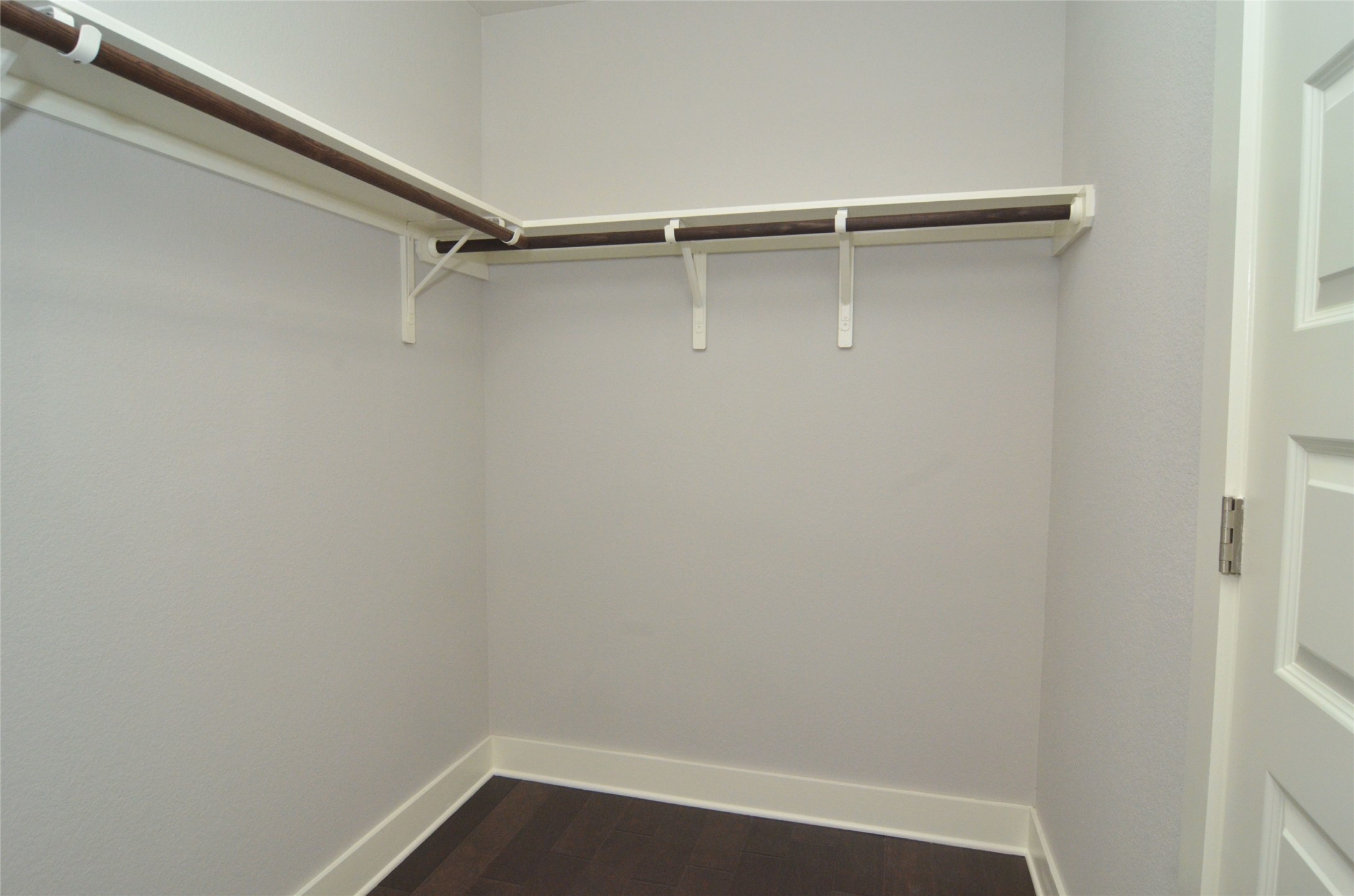 1916 Cleese Drive Austin, TX 78741 - Photo 25 of 36 A well-organized closet space with ample shelving and hanging rods for versatile storage.