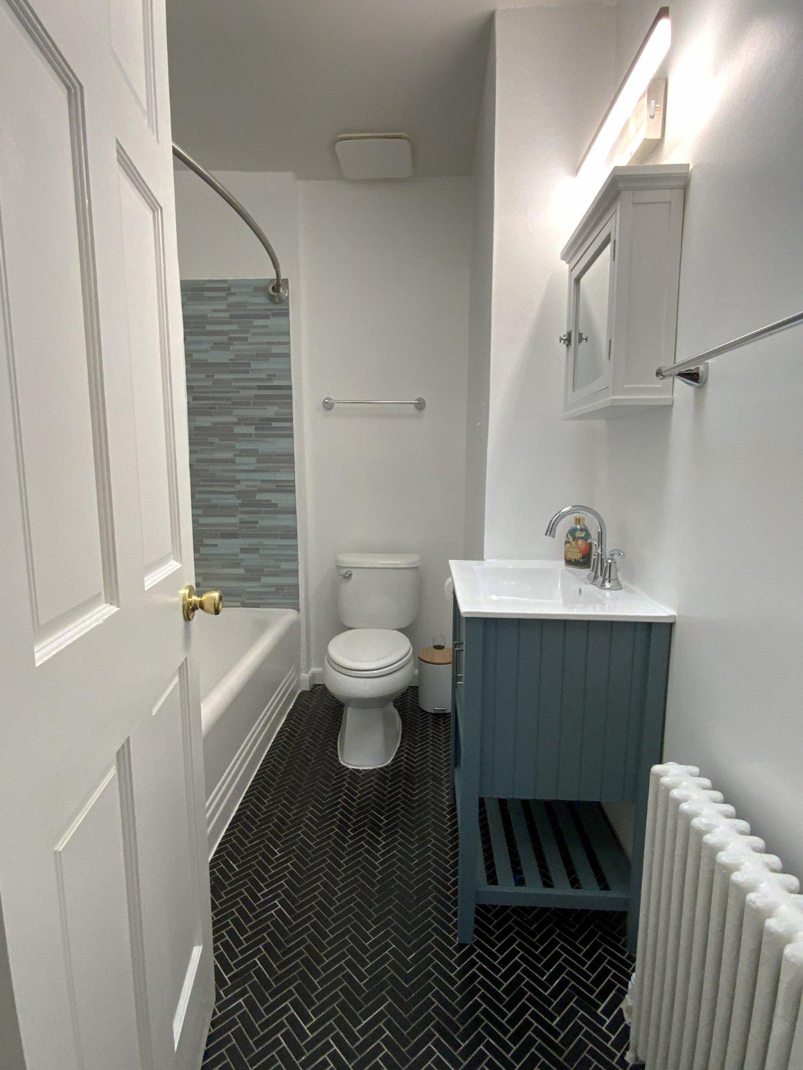 1772 E Street Northeast Washington, DC 20002 - Photo 15 of 23 a bathroom with a sink toilet and shower