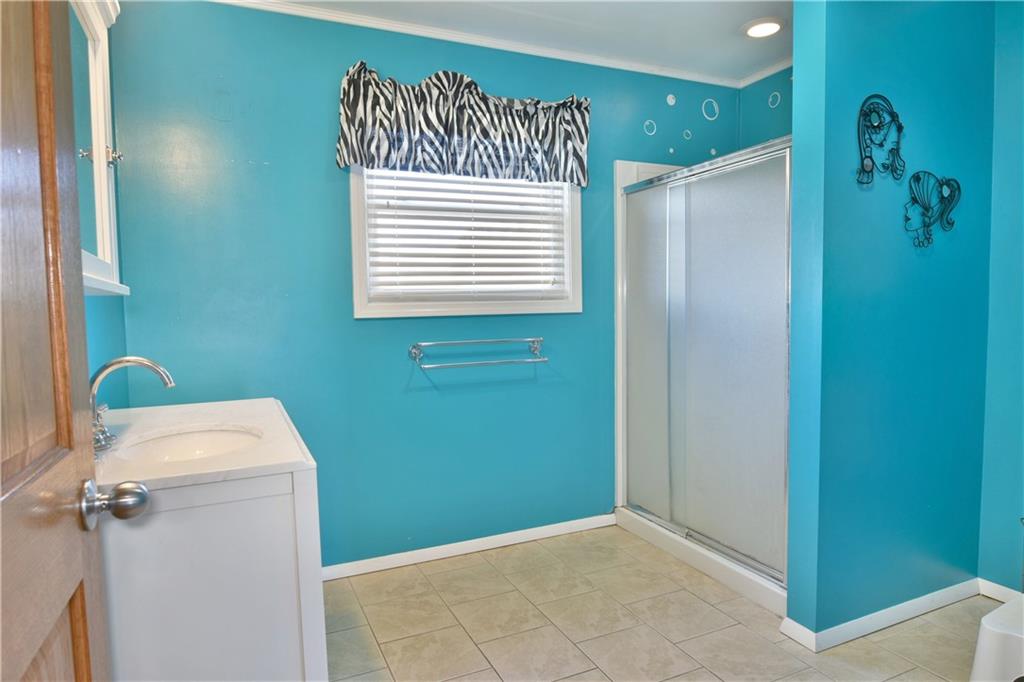 3641 Hubbard-Middlesex Road West Middlesex, PA 16159 - Photo 8 of 18 a bathroom with a window and a shower