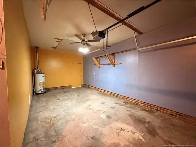 a view of a big room with a ceiling fan