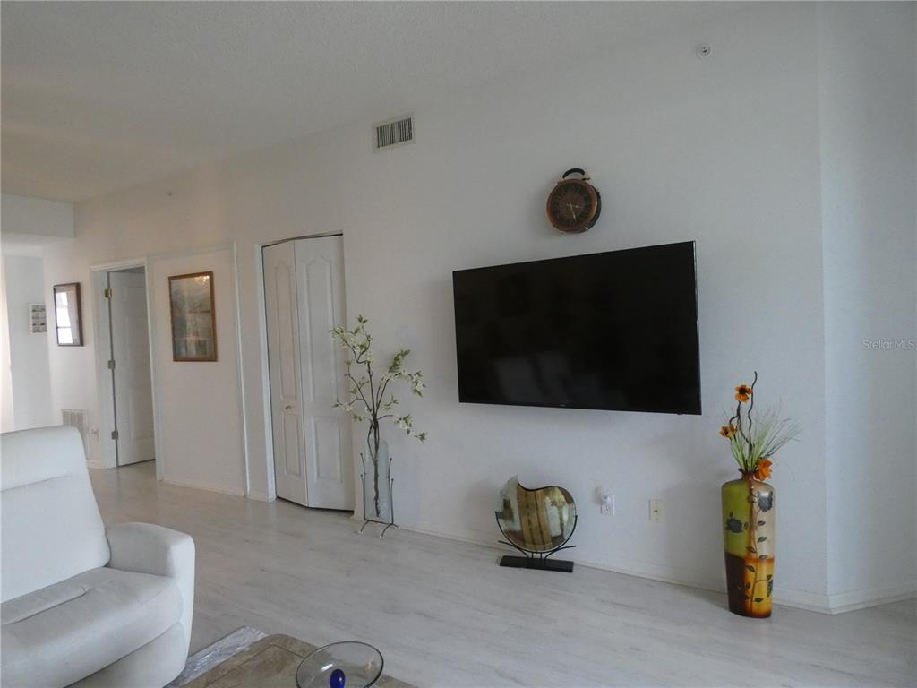 8901 Veranda Way, Unit 111 Sarasota, FL 34238 - Photo 11 of 41 a living room with furniture and a flat screen tv