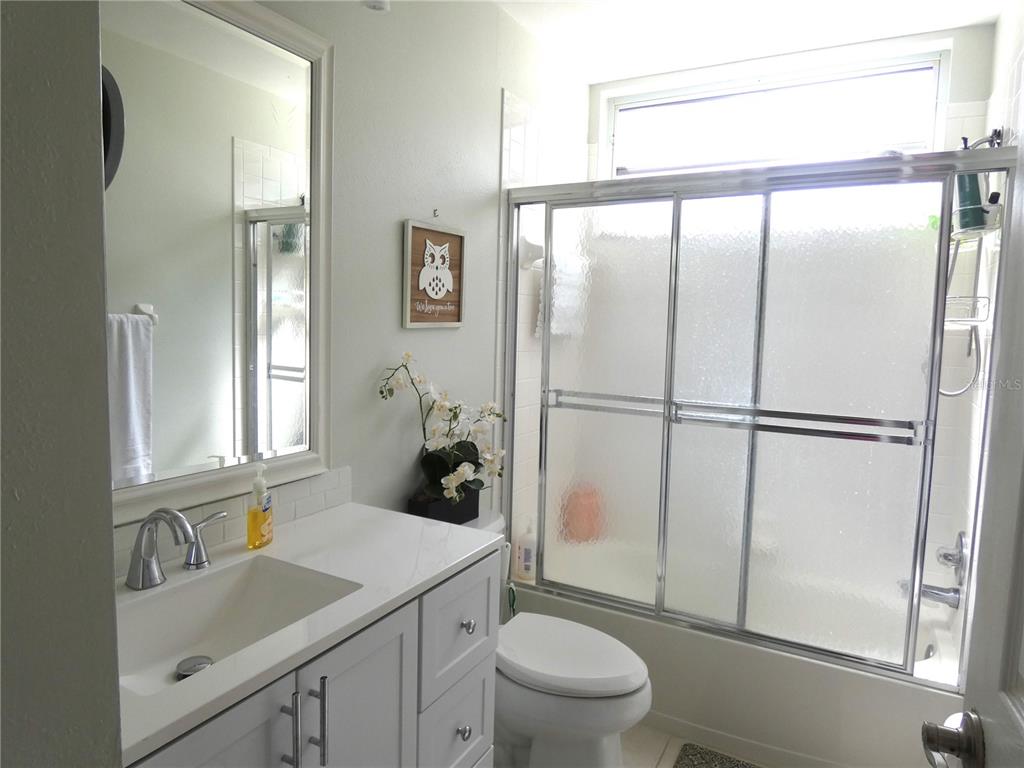 8901 Veranda Way, Unit 111 Sarasota, FL 34238 - Photo 21 of 41 a bathroom with a sink toilet and shower