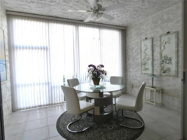 a dining room with furniture and window