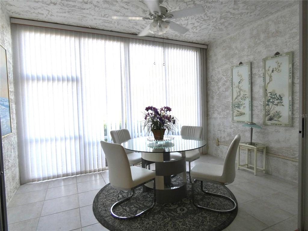 8901 Veranda Way, Unit 111 Sarasota, FL 34238 - Photo 22 of 41 a dining room with furniture and window