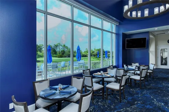 a view of a dining room with furniture window and outside view