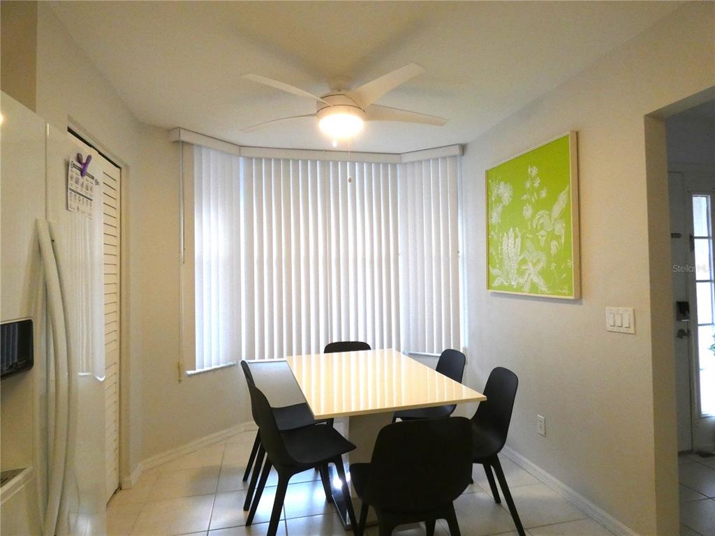 8901 Veranda Way, Unit 111 Sarasota, FL 34238 - Photo 5 of 41 a view of a dining room with furniture and a window