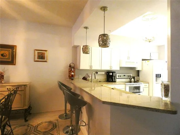 a kitchen with sink cabinets and window