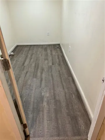 a view of wooden floor in a bathroom