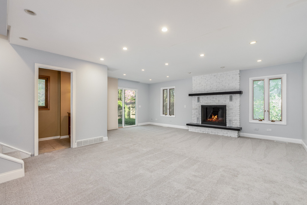 1570 Burning Trail Wheaton, IL 60189 - Photo 14 of 30 an empty room with windows and fireplace
