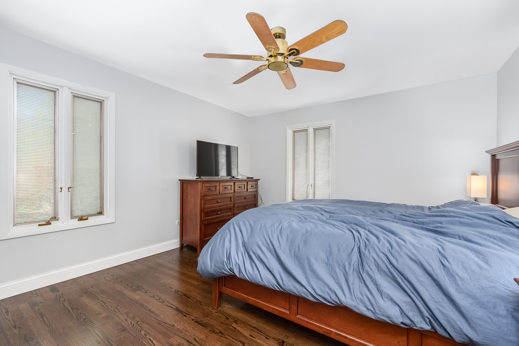 1570 Burning Trail Wheaton, IL 60189 - Photo 19 of 30 a bedroom with a bed and a flat screen tv