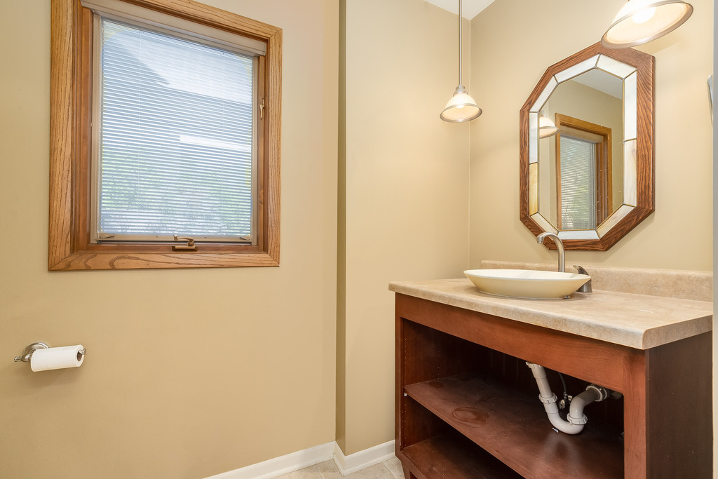 1570 Burning Trail Wheaton, IL 60189 - Photo 24 of 30 a bathroom with a sink a vanity and a mirror
