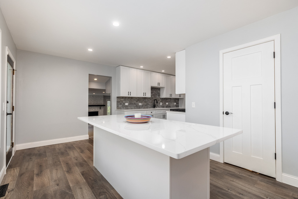 1570 Burning Trail Wheaton, IL 60189 - Photo 9 of 30 a view of kitchen with stainless steel appliances cabinets and wooden floor