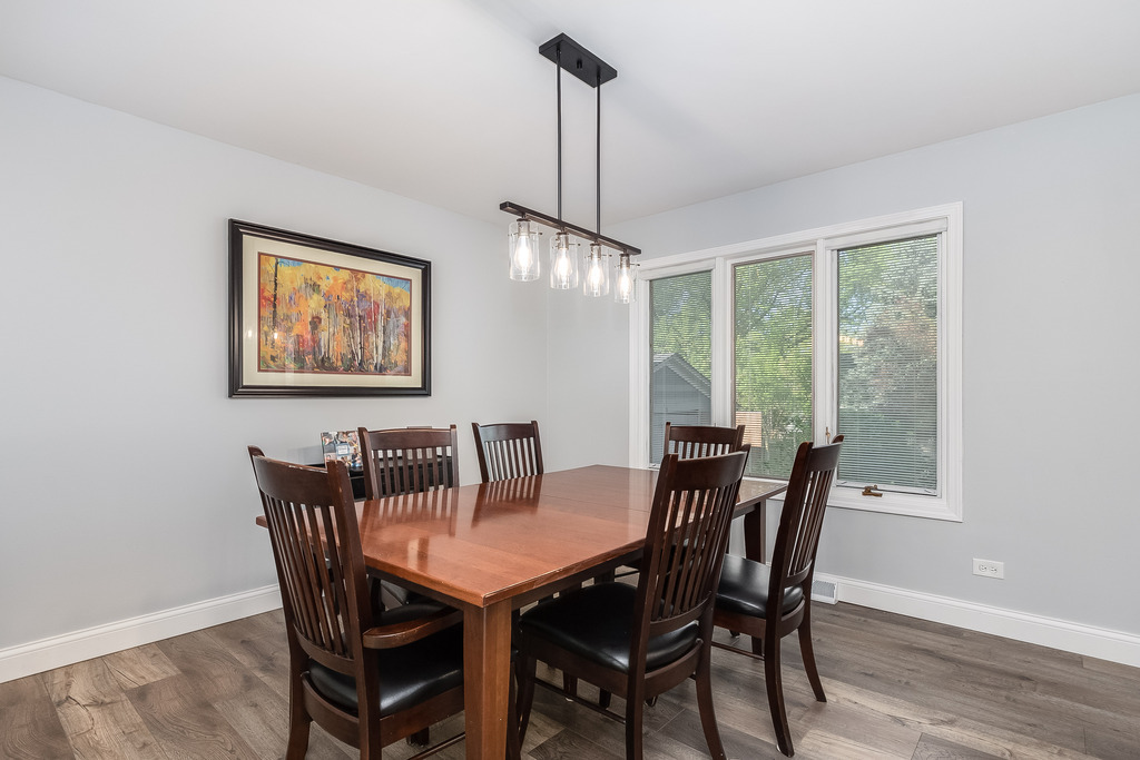 1570 Burning Trail Wheaton, IL 60189 - Photo 10 of 30 a view of a dining room with furniture window and wooden floor