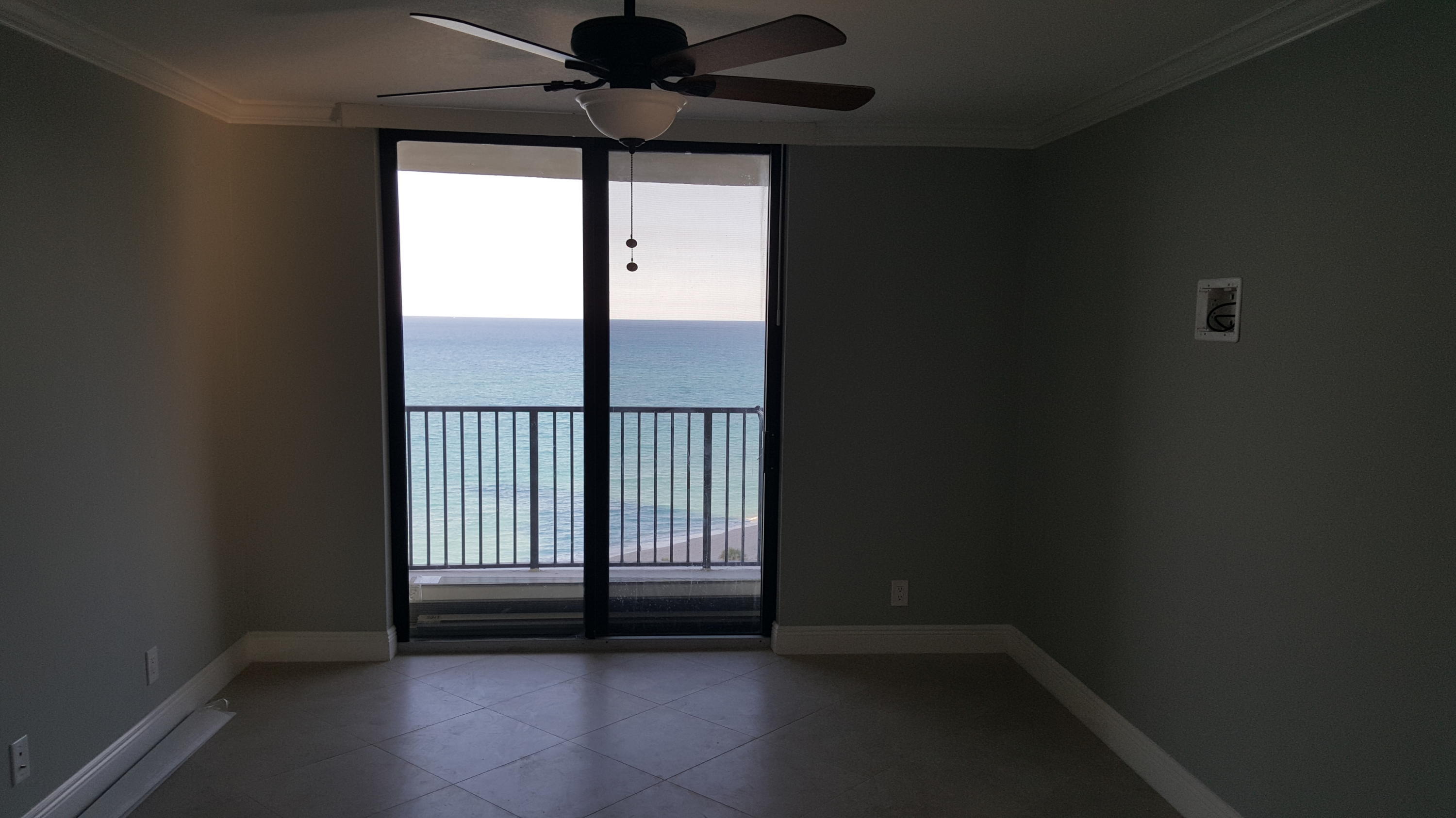 200 Ocean Trail Way, Unit 1105 Jupiter, FL 33477 - Photo 11 of 35 wooden floor in an empty room with a window