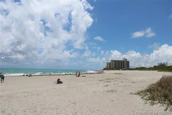 a view of a beach with a city view