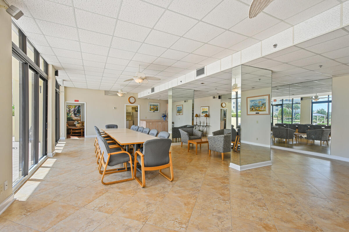 200 Ocean Trail Way, Unit 1105 Jupiter, FL 33477 - Photo 23 of 35 a dining room with furniture and wooden floor