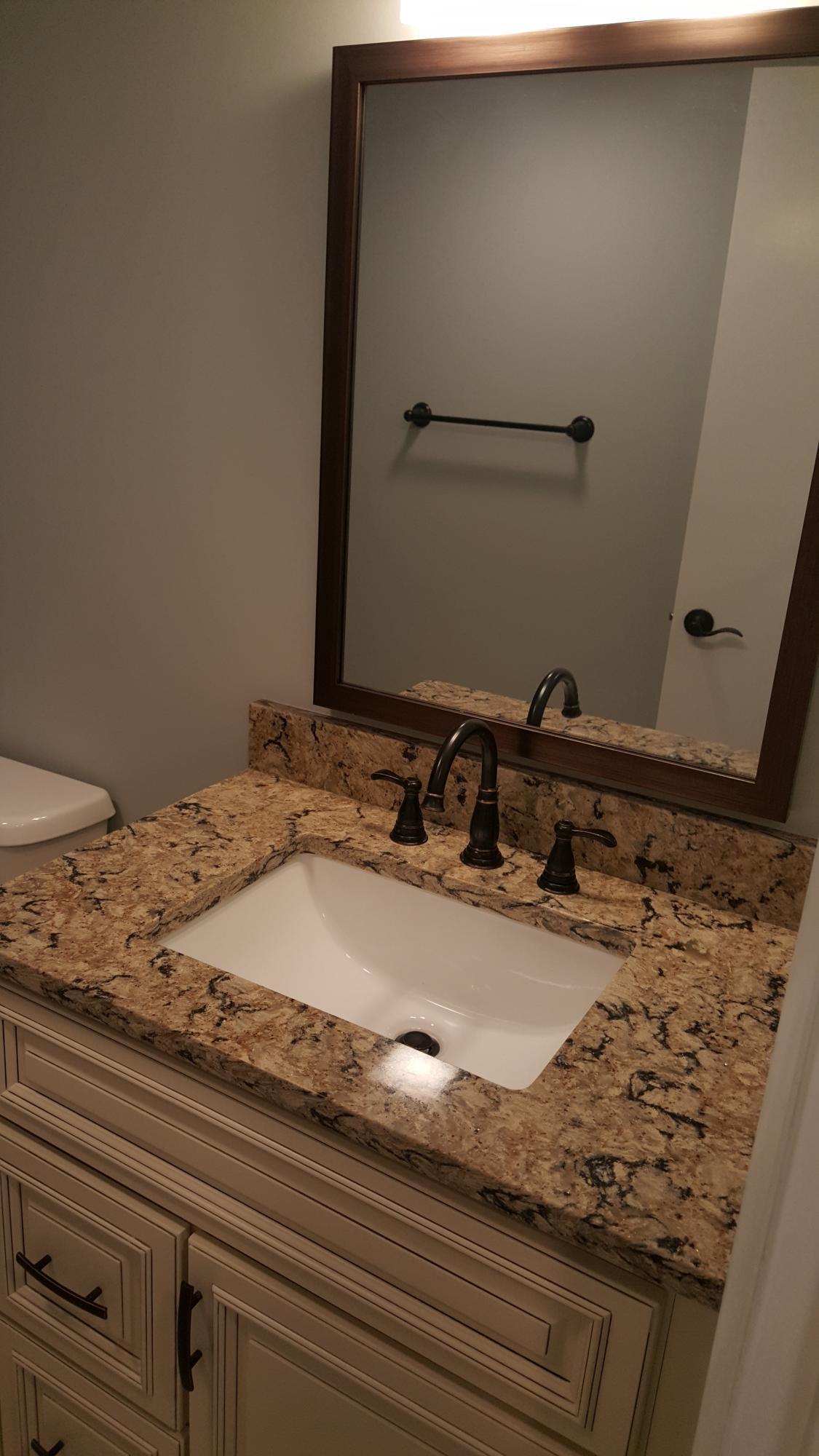 200 Ocean Trail Way, Unit 1105 Jupiter, FL 33477 - Photo 8 of 35 a bathroom with a granite countertop sink and a mirror