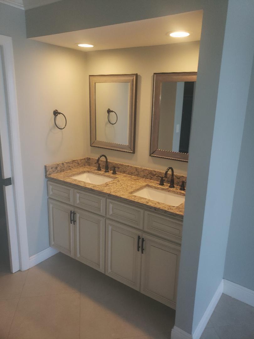 200 Ocean Trail Way, Unit 1105 Jupiter, FL 33477 - Photo 9 of 35 a bathroom with 2 sink and a mirror