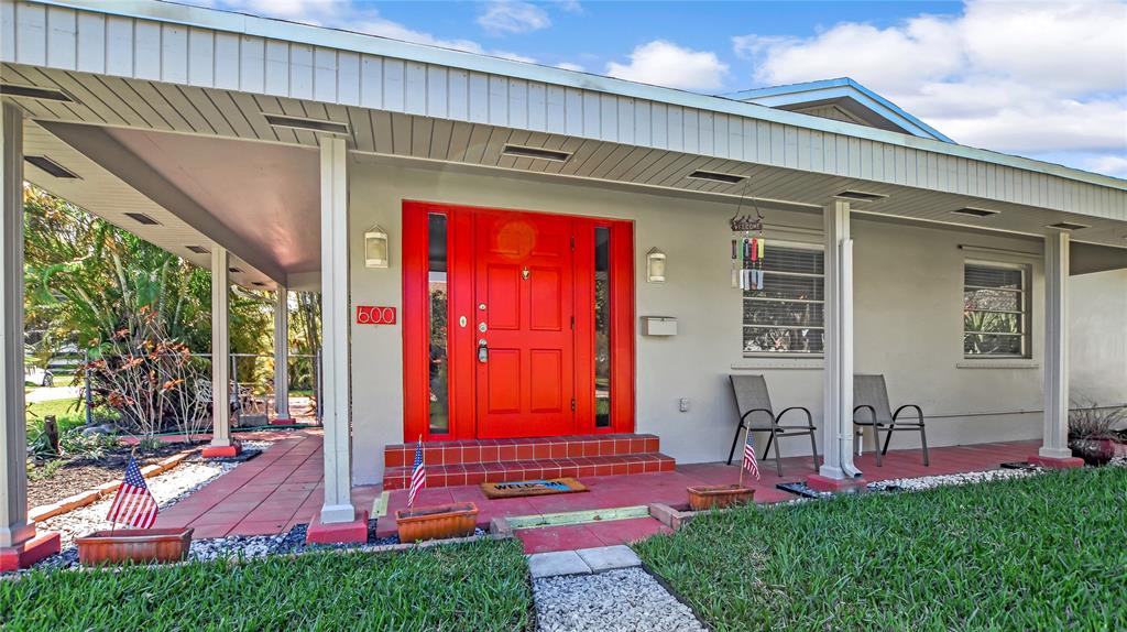 a view of front door and yard