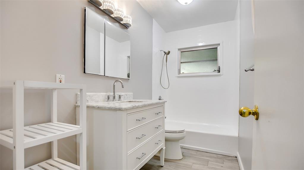 600 Southwest 19th Street Fort Lauderdale, FL 33315 - Photo 15 of 24 a bathroom with a granite countertop sink toilet and shower