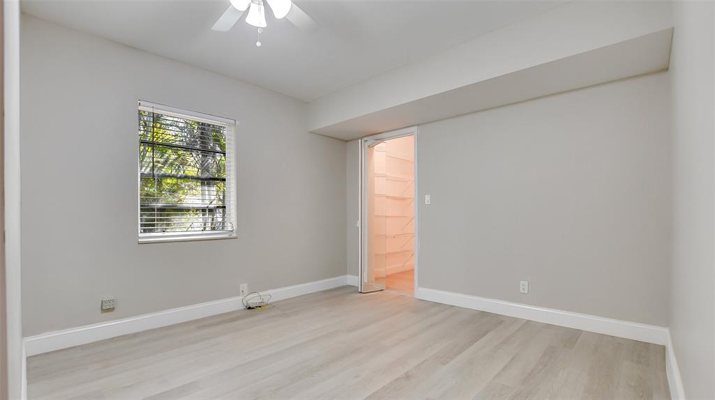 600 Southwest 19th Street Fort Lauderdale, FL 33315 - Photo 18 of 24 an empty room with a window and a chandelier fan