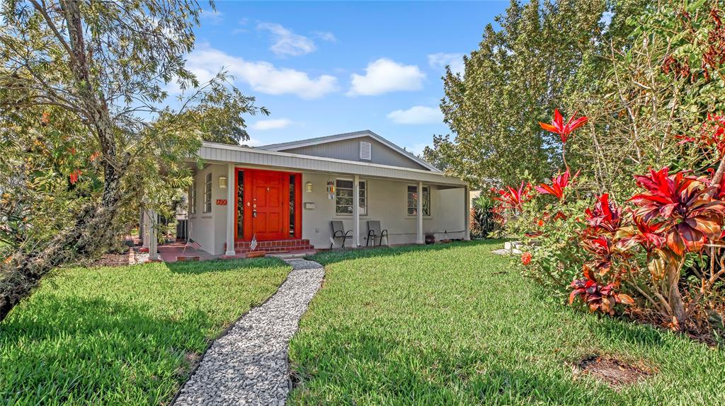 600 Southwest 19th Street Fort Lauderdale, FL 33315 - Photo 21 of 24 a front view of a house with a big yard and potted plants
