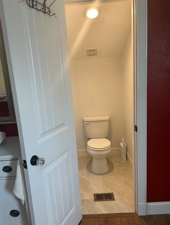 1794 Cr 527 Road Baird, TX 79504 - Photo 34 of 38 Recessed lighting, tiled flooring, built-in ventilation, and a white paneled door with a crystal knob
