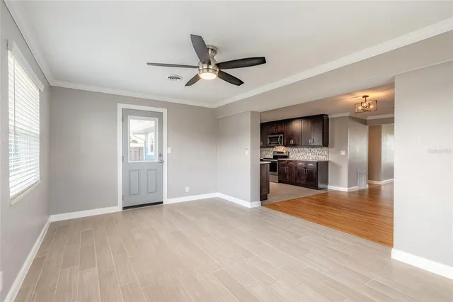 a view of a kitchen with a sink hardwood floor and a window