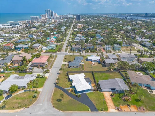 an aerial view of a house with a swimming pool