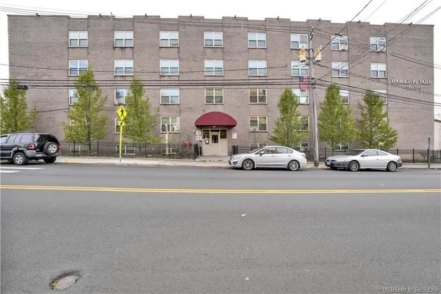 a view of a car parked in front of a building