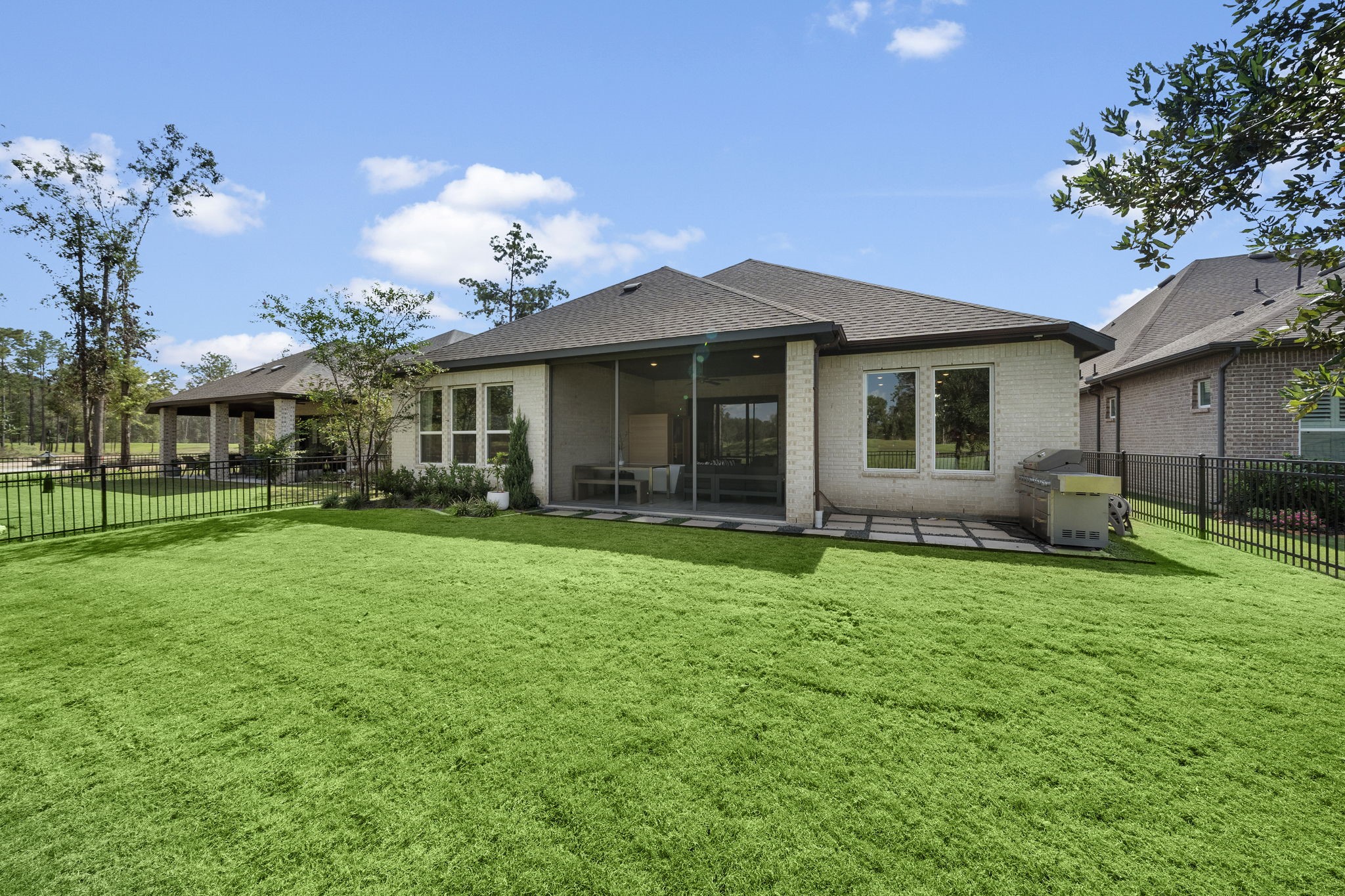 7551 Congress Trl Way Porter, TX 77365 - Photo 32 of 49 Another look at the stunning backyard with uninterrupted views of the golf course, making every moment spent outdoors a peaceful retreat.
