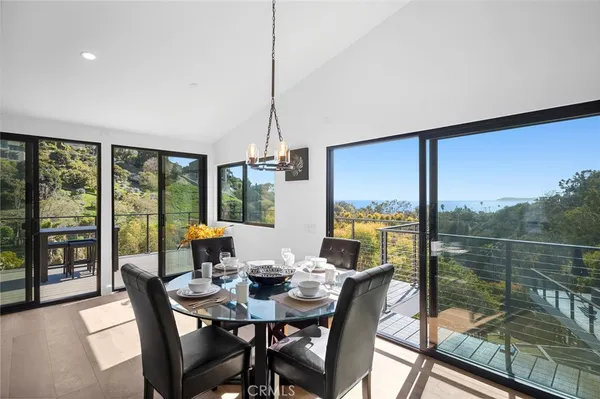 a view of a dining room with furniture window and outside view
