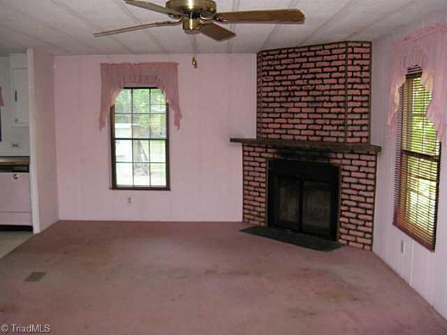 4535 Kime Farm Road Climax, NC 27233 - Photo 5 of 16 Exterior Front. Wood burning fireplace