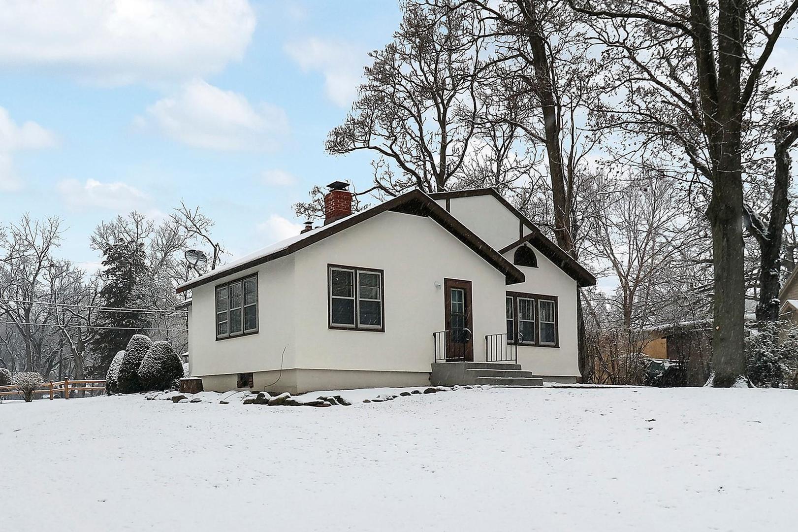 7608 Beverly Way Spring Grove, IL 60081 - Photo 8 of 25 a view of a house with a yard covered in snow