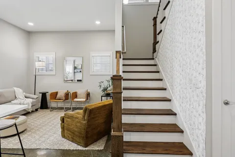 a bedroom with a bed and a couch