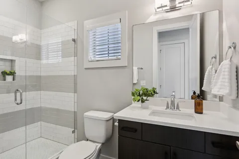 a bathroom with a bathtub and shower