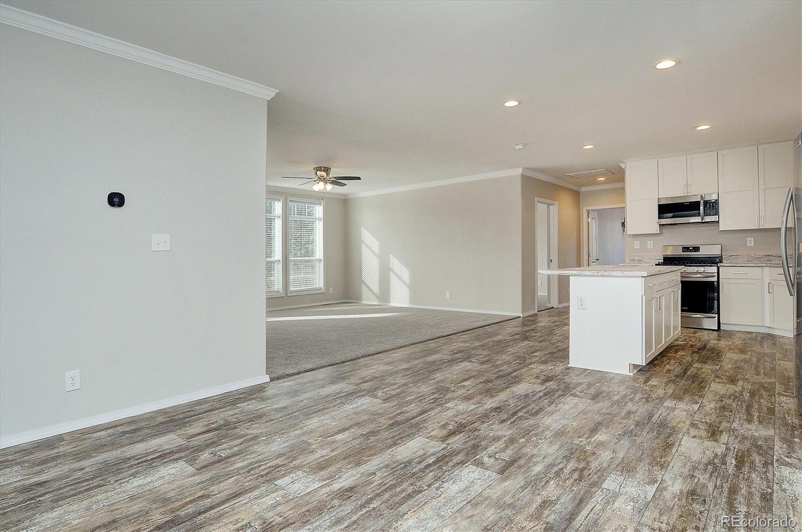 16554 Rocky Mountain Road Salida, CO 81201 - Photo 11 of 33 a view of a kitchen with a sink and a refrigerator